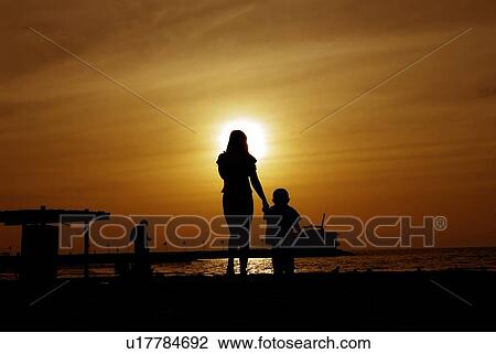 Stock Image - sunset, sunrise, rise, dubai, beach, happy, familly. Fotosearch
