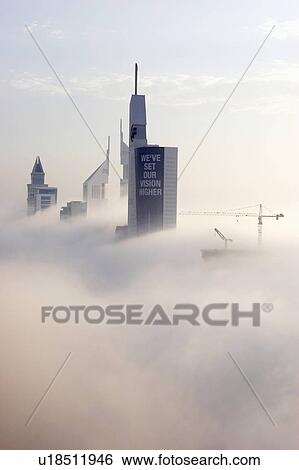 Stock Photograph - dubai, fog, early, morning, sheikh, zayed, road. Fotosearch
