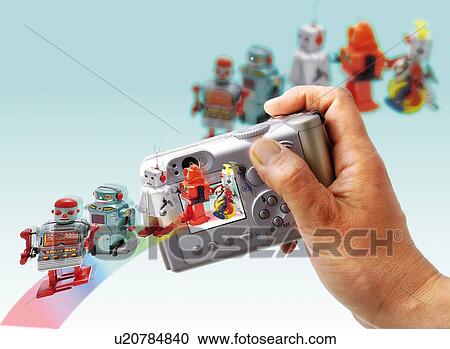 Toy Doll, Robots and Digital Camera, High Angle View, Differential Focus View Large Illustration Clipart - Toy Doll, Robots and Digital Camera, High Angle View, Differential Focus. Fotosearch