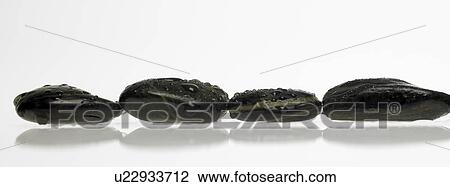 Stock Image - Black stones. Fotosearch