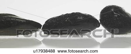 Stock Photo - Black stones. Fotosearch