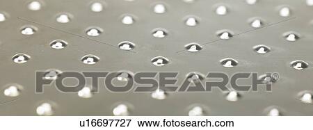 Bumpy metal surface close up View Large Photo Image Stock Photo - Bumpy metal surface close up. Fotosearch
