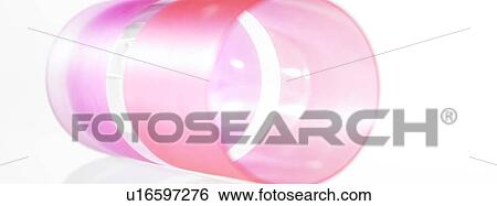 Stock Photograph - Pink plastic cup lying on side. Fotosearch