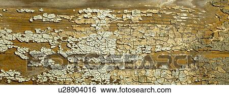 Stock Photograph - Wood and cracked paint close up. Fotosearch