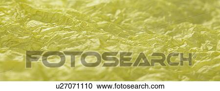 Stock Image - Yellow textured paper surface close up. Fotosearch