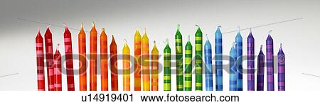 Stock Image - Colourful candles in a row. Fotosearch