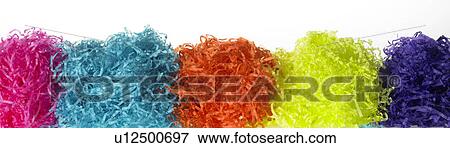 Stock Photo - Five bunches of colored paper in a row. Fotosearch