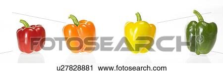 Stock Image - Four Colored Peppers in a row. Fotosearch