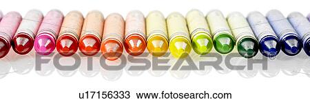 Stock Image - Row of various colored wax crayons. Fotosearch