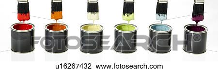 Stock Image - Six assorted colored paints and paintbrushes in a row. Fotosearch