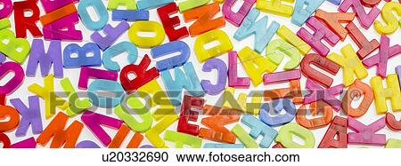 Stock Image - Various coloured plastic letter magnets. Fotosearch
