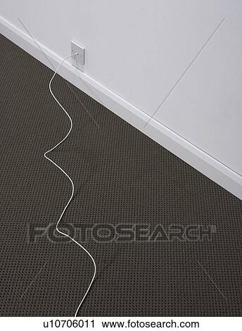 Stock Image - A phone cord and plug.. Fotosearch