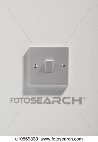 Stock Photo - Electrical light switch on white wall.. Fotosearch