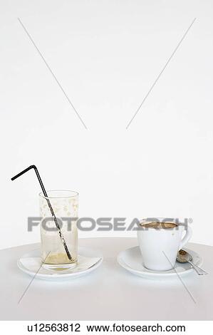 Empty glass with straw and cup of expresso. View Large Photo Image Stock Image - Empty glass with straw and cup of expresso.. Fotosearch
