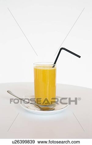 Glass of orange juice with straw. View Large Photo Image Stock Photo - Glass of orange juice with straw.. Fotosearch