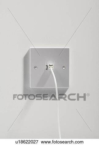 Telephone plug on a white wall. View Large Photo Image Stock Photo - Telephone plug on a white wall.. Fotosearch