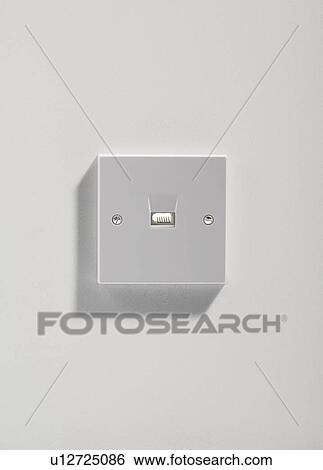 Telephone plug on a white wall. View Large Photo Image Stock Photograph - Telephone plug on a white wall.. Fotosearch