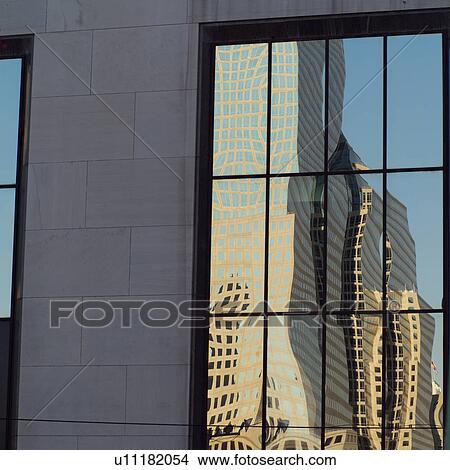 Reflection of buildings in window View Large Photo Image Picture - Reflection of buildings in window. Fotosearch