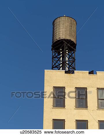 Stock Photography - Watertower on top of a building, New York City. Fotosearch