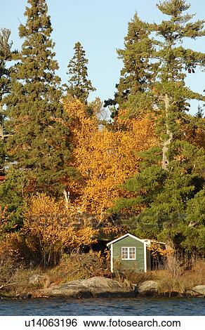 Stock Photograph - Small Shed on Shoreline. Fotosearch
