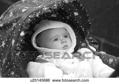 Stock Photograph - Baby in a pram in Prague. Fotosearch