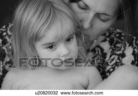 Close up of a mother holding her daughter View Large Photo Image Stock Image - Close up of a mother holding her daughter. Fotosearch