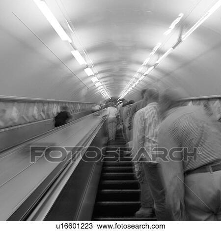 People on an escalator in an underground subway station in London, England View Large Photo Image Stock Image - People on an escalator in an underground subway station in London, England. Fotosearch