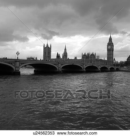 Stock Image - View of the house of parliament across the river Thames, London, England. Fotosearch