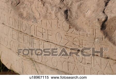 Stock Photography - Carvings on a column of a historical building in Athens, Greece. Fotosearch