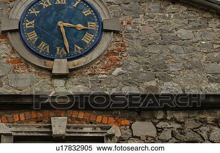 Ireland - Clock on wall in Kilkenny View Large Photo Image Stock Photography - Ireland - Clock on wall in Kilkenny. Fotosearch