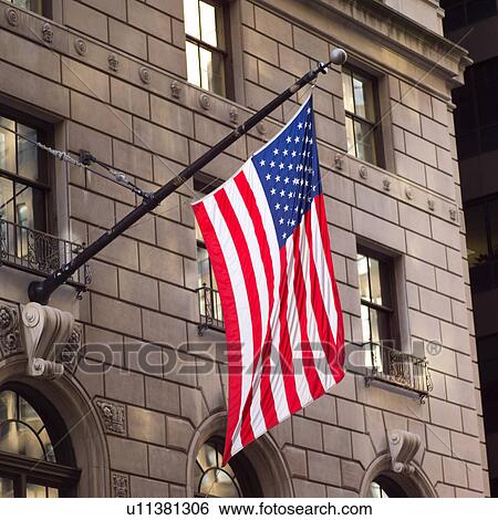 American flag outside a building View Large Photo Image Stock Photograph - American flag outside a building. Fotosearch