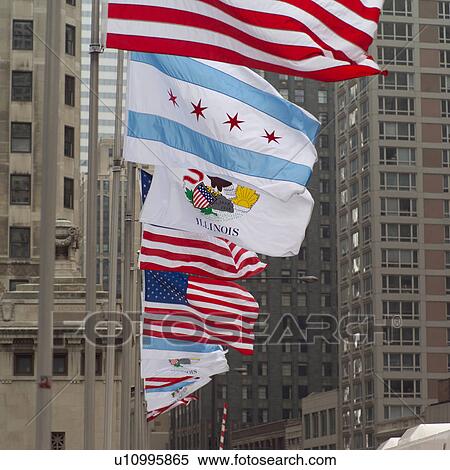 Flags in a row in front of a building View Large Photo Image Stock Photography - Flags in a row in front of a building. Fotosearch