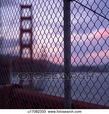Golden Gate Bridge through fencing at Sunset View Large Photo Image Stock Image - Golden Gate Bridge through fencing at Sunset. Fotosearch