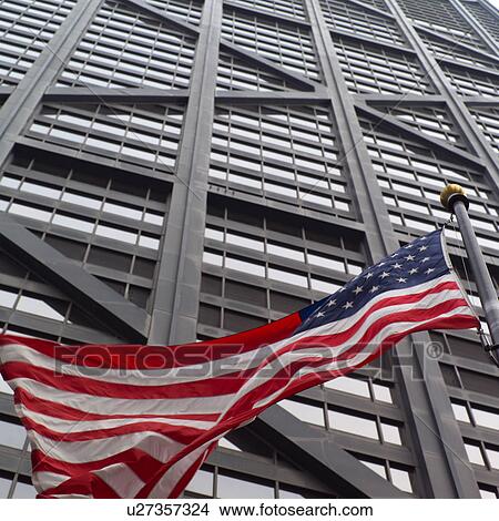 Low angle view of the American flag outside John Hancock Building in Chicago View Large Photo Image Picture - Low angle view of the American flag outside John Hancock Building in Chicago. Fotosearch