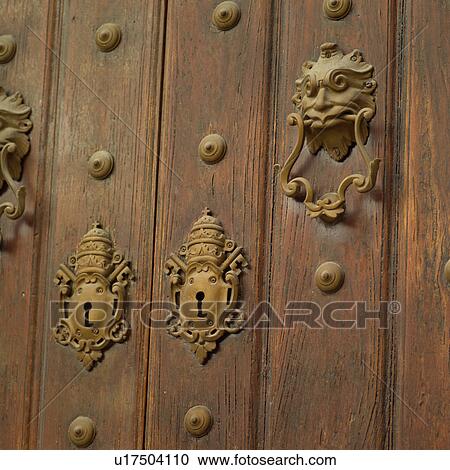 Close-up of a door with ornate brass fixtures View Large Photo Image Stock Image - Close-up of a door with ornate brass fixtures. Fotosearch