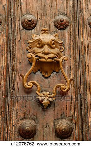 Close-up of an ornate brass door knocker View Large Photo Image Stock Image - Close-up of an ornate brass door knocker. Fotosearch