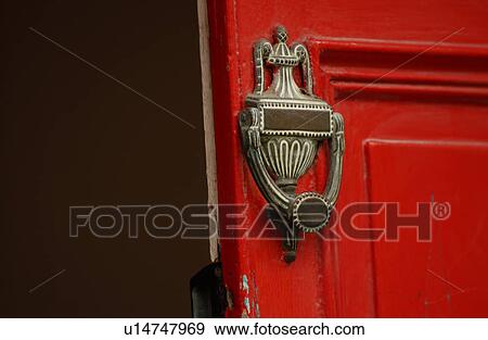 Stock Photo - Door knocker on red door. Fotosearch