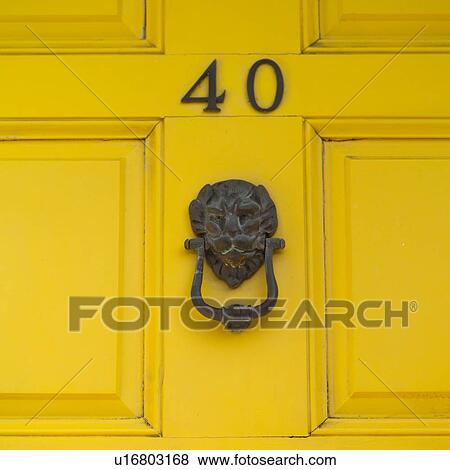 door knocker on yellow door View Large Photo Image Stock Photo - door knocker on yellow door. Fotosearch