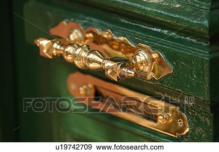 Stock Photo - Golden handle of a door. Fotosearch
