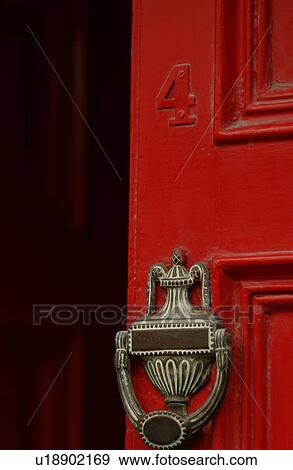 Ireland - Kilkenny - Door knocker on red door View Large Photo Image Stock Photo - Ireland - Kilkenny - Door knocker on red door. Fotosearch