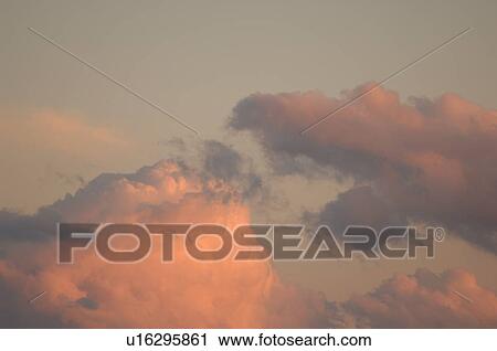 Clouds at sunset in the sky View Large Photo Image Stock Image - Clouds at sunset in the sky. Fotosearch
