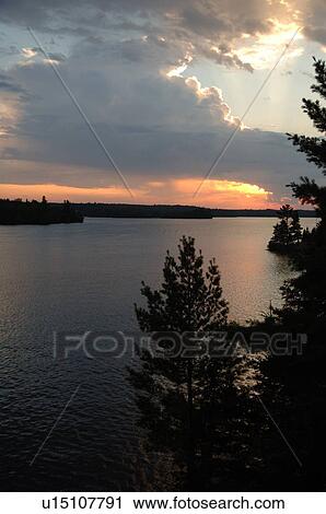 Sunlight through clouds at twilight View Large Photo Image Stock Image - Sunlight through clouds at twilight. Fotosearch