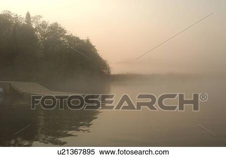 Stock Photography - Lake of the Woods at sunrise. Fotosearch