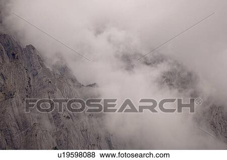 Stock Photo - Low cloud over Rocky Mountains. Fotosearch