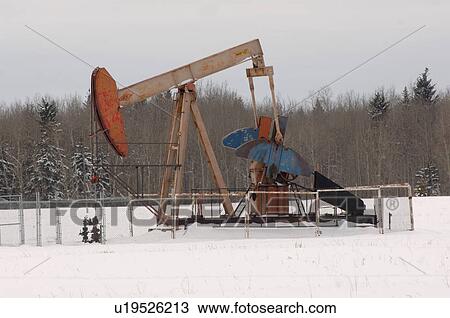 Oil Well in Field of Snow in Alberta Canada View Large Photo Image Stock Image - Oil Well in Field of Snow in Alberta Canada. Fotosearch