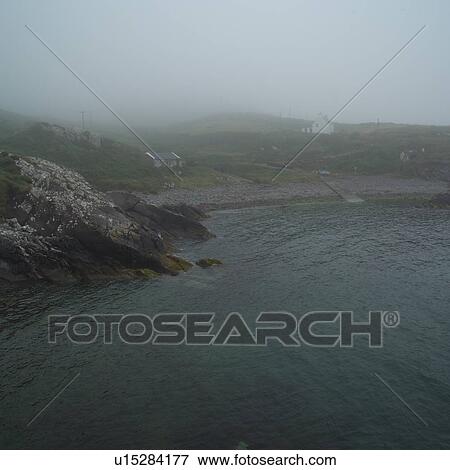 Stock Photo - Ireland - countryside buildings by the sea. Fotosearch