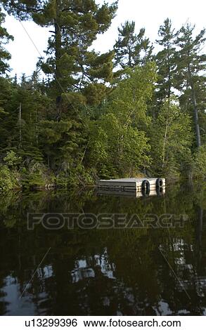 Lake Photography - Lakeshore with boat dock View Large Photo Image Stock Photograph - Lake Photography - Lakeshore with boat dock. Fotosearch