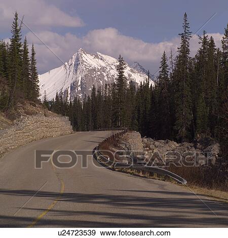 Stock Photo - Highway through the Rocky Mountains. Fotosearch