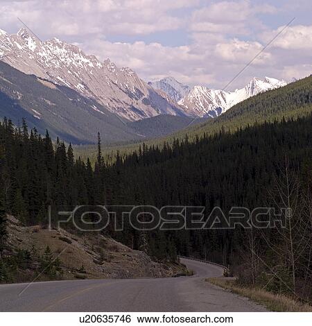 Stock Photograph - Highway through the Rocky Mountains. Fotosearch