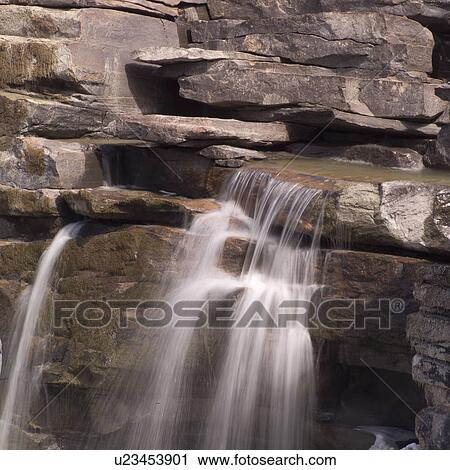 Waterfall over rocks View Large Photo Image Stock Image - Waterfall over rocks. Fotosearch